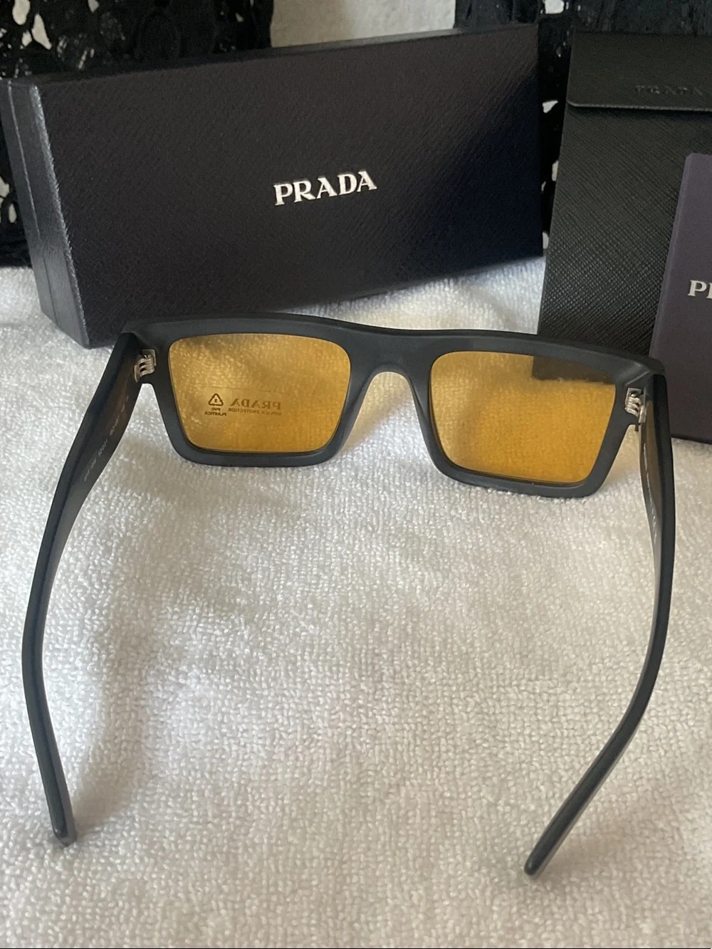 Prada Matte Black Rectangular Sunglasses with Amber Lenses